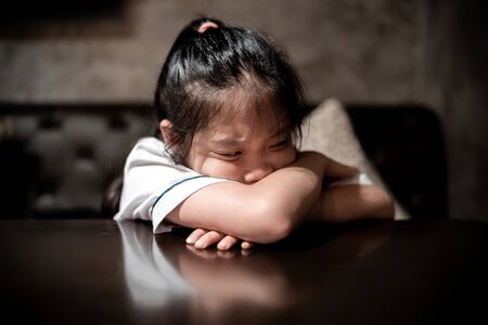 Angry and depressed child with sad and stressful facial expression.の写真素材