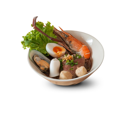 Thai noodles with seafood and pork on white backgroundの写真素材
