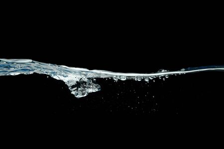 Dark water waves isolated on black background.の写真素材