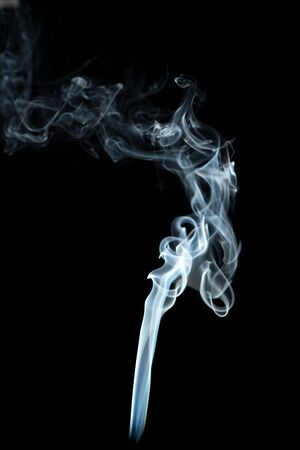 white smoke on the black background.の写真素材