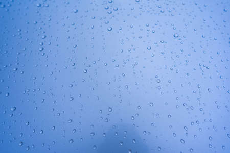Blue water drops background. drops water in the rainy season.