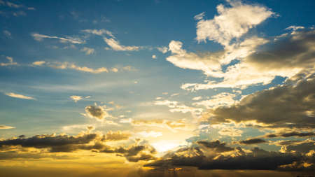 silhouette Men with women standing on the mountain with sunset in the evening.の写真素材