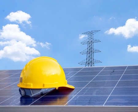Solar panel concept on sky background. yellow helmet safetyの写真素材