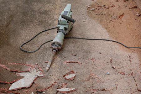 Mortar drilling machine on cracked concrete floor