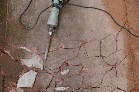 Mortar drilling machine on cracked concrete floor
