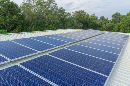 solar cells panel installed on the roof of a large building are full of dirt and dust.の写真素材
