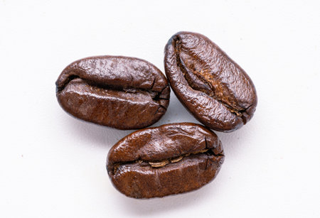 close up coffee beans isolated white backgroundの写真素材
