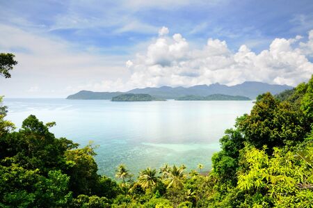 Aerial view on the tropical island, turquoise sea, mountains, blue sky and scenic clouds at the Koh Chang island, Thailand.の写真素材