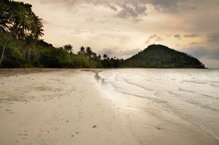 Sunset on the tropical sandy beach on the Koh Chang island in Thailand.の写真素材