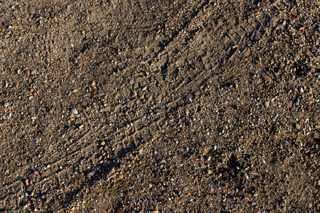 brown sand and stone texture closeup horizontal background, natural backgroundの写真素材