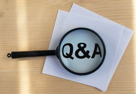 questions and answers concept - Q and A - magnifying glass on wooden background, stickersの写真素材
