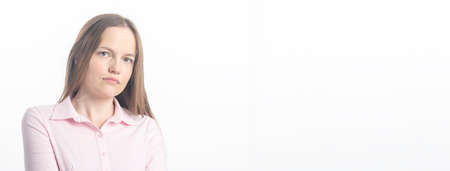 Close up studio shot of beautiful Caucasian young woman businesswoman looking at the camera with...