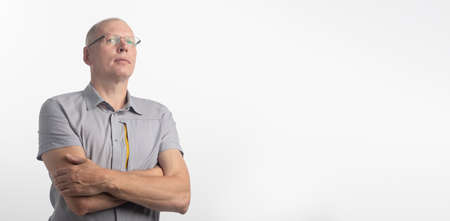 Man with arrogant expression looking down, studio shot isolated on white background, copy space, bannerの写真素材