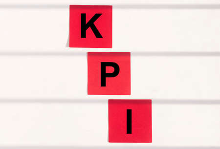 KPI acronym Key Performance Indicator word text inscription on paper sticker, office tableの写真素材