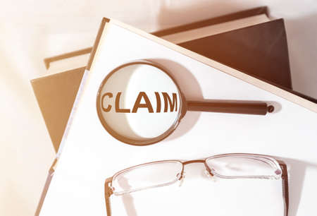 Claim word on paper, lawsuit and claims conceptの写真素材