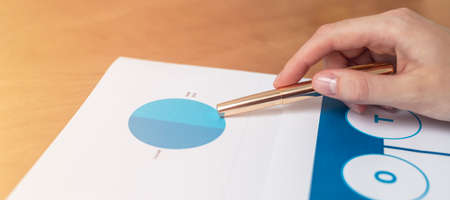Strength Weaknesses Opportunities Threats Analysis Evaluation Strategy Concept. blue SWOT chart on office table with female hands with pen, marketing strategy, businessの写真素材