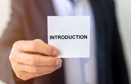 Introduction. word Text on a sheet of paper. hand of businessman, business introduction conceptの写真素材
