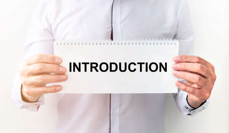Introduction. word Text on a sheet of paper. hand of businessman, business introduction conceptの写真素材