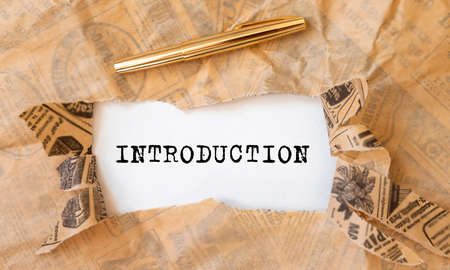 Introduction Word on paper through torn craft paper, inscription introductionの写真素材