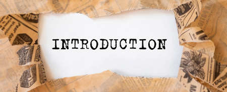 Word INTRODUCTION on paper on office desk, introduction concept