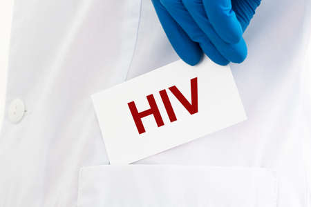 HIV acronym - Human Immunodeficiency Virus - word on paper in doctor hands as medical concept.の写真素材