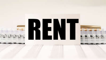 RENT word on paper on office table close up.の写真素材
