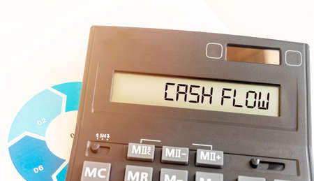 CASHFLOW word on calculator and documents close up. financial concept.の写真素材
