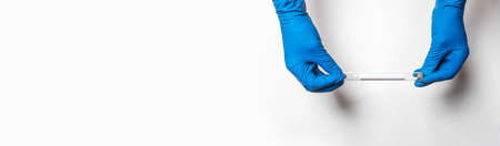 Test lab tube in doctor hands in gloves over white banner with copy space for text.