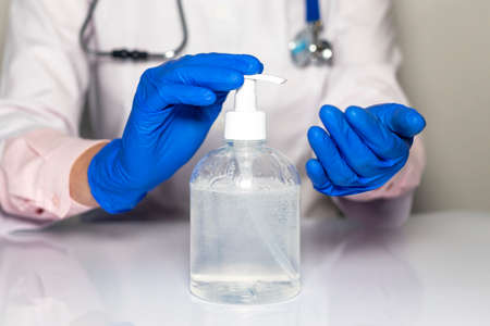 Doctor hands in gloves with stethoscope, medical exam concept.の写真素材