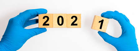 2021 year concept in medicine. inscription in hands in gloves.