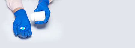 Female doctor hand showing handful of capsules or pills for curing disease. Closeup of vitamins....