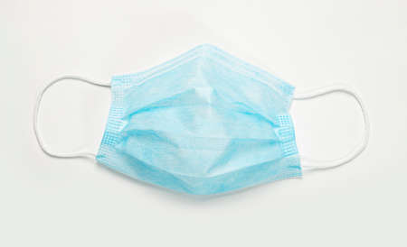 Face protective mask isolated on white, flatlay.
