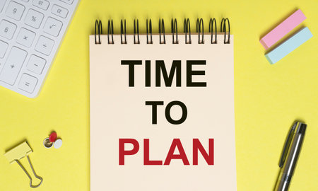Time to Plan inscription on notebook on office yellow desk.の写真素材