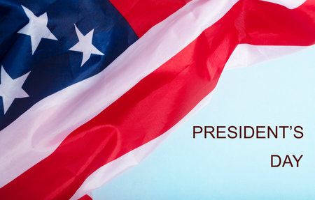 President's day inscription and american flag background.