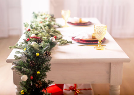 Table served for two for celebrating Christmas and New year, side view.の写真素材
