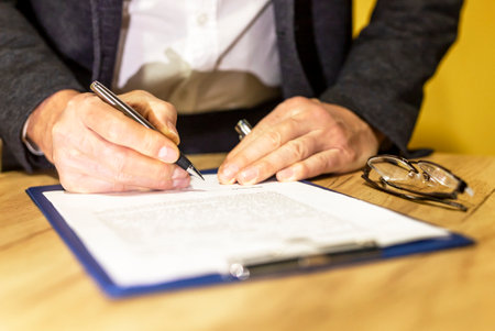 Male hands signing contract close up. agreement.の写真素材