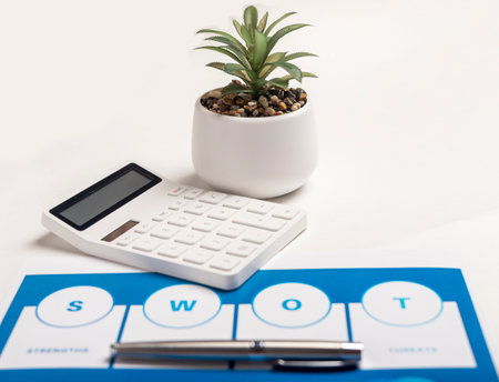 SWOT analysis at table with calculator. Business managementの写真素材