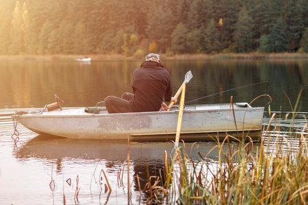 Man fishing on boat in lake or river. Hobbyの写真素材
