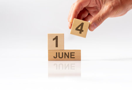 14 June inscription on wooden cube calendar. Donor day or flag day.の写真素材