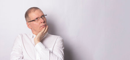 Unproductive dreaming man or businessman. Pensive man in idea planning. Copy spaceの写真素材