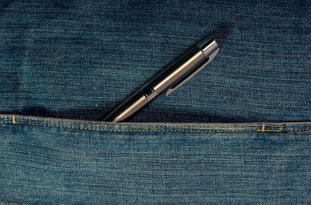 Silver pen in jeans pocket, denim close up.の写真素材