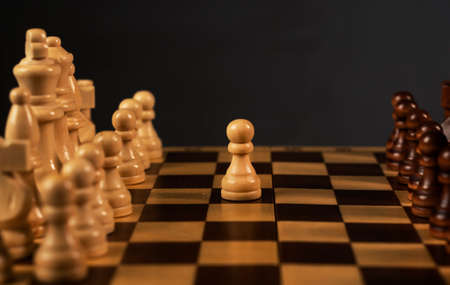 First step of white pawn on chess chessboard. Start concept.の写真素材