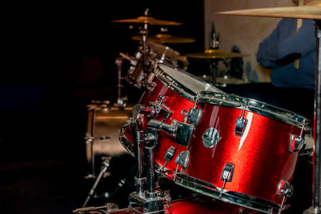 Male hand and drums with metal plates.の写真素材