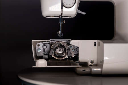 Bobbin and other metal parts in electric sewing machine.の写真素材
