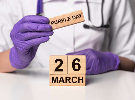 26 March, date on wooden calendar. World epilepsy purple day.の写真素材