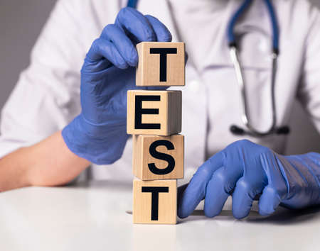Word test in female hands. medical concept.