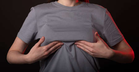 Woman touching, examining her breast. Self screening, examination and detection.の写真素材