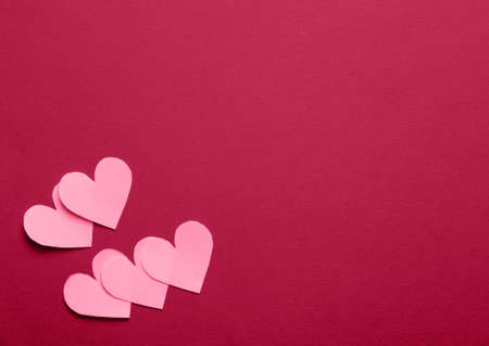 Minimal background for St. Valentine Day. Banner with paper hearts and copy space for text.