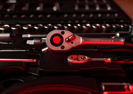 Open toolkit with different metal steel tools for building and repair, closeup.