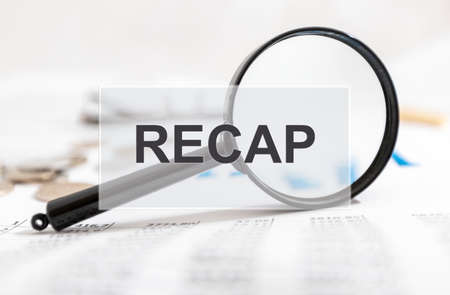 Recap word over image with financial documents and magnifying glass.の写真素材